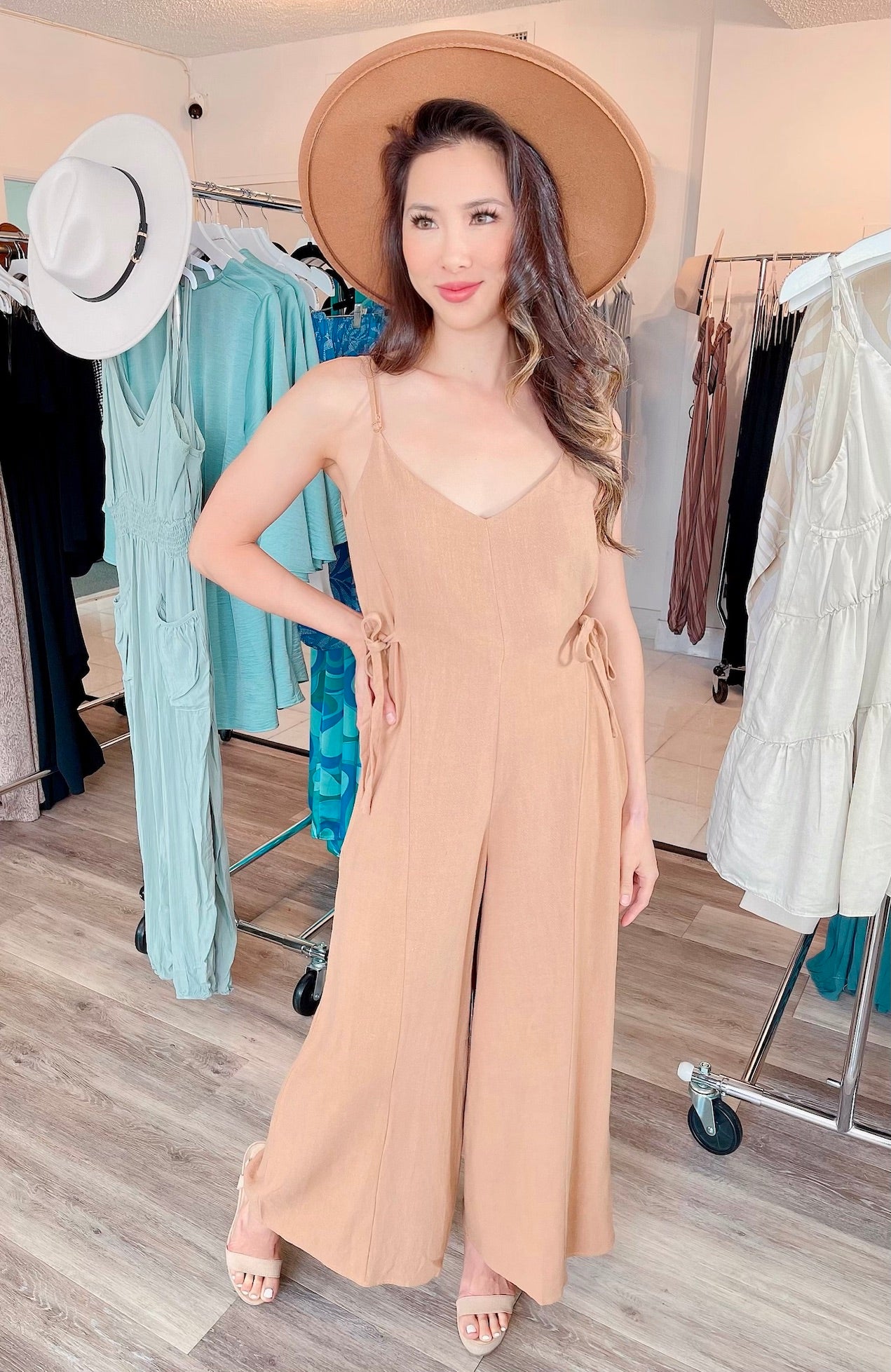 
                  
                    V-Neck Tie Side Spaghetti Strap Jumpsuit with Criss Cross Back Detail
                  
                