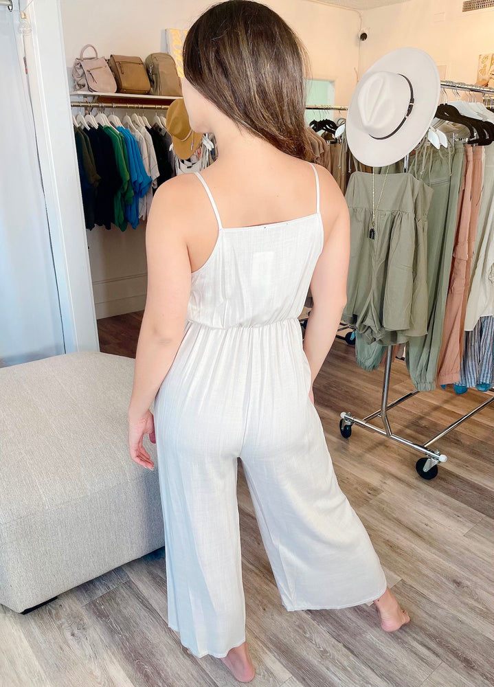 
                  
                    FINAL SALE- Spaghetti Strap Tie Front Wrap Woven Jumpsuit with Pockets
                  
                
